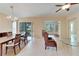 Bright dining area with a view of the golf course from sliding glass doors at 1013 Emerald Dunes Dr, Sun City Center, FL 33573