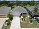 Aerial view of single Gathering home and landscaping at 1013 Emerald Dunes Dr, Sun City Center, FL 33573