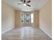 Spacious bedroom featuring wood-look floors and a bay window at 1013 Emerald Dunes Dr, Sun City Center, FL 33573