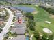 Aerial view highlighting the home's location near a golf course and lake at 1013 Emerald Dunes Dr, Sun City Center, FL 33573