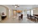Bright and airy living room with hardwood floors and views of the kitchen at 1013 Emerald Dunes Dr, Sun City Center, FL 33573