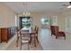 Formal dining room with chandelier, hardwood floors and backyard access at 1013 Emerald Dunes Dr, Sun City Center, FL 33573