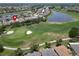 Aerial view of home on golf course community at 1013 Emerald Dunes Dr, Sun City Center, FL 33573