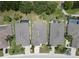 Aerial view of three homes with pools in a community at 1013 Emerald Dunes Dr, Sun City Center, FL 33573