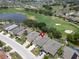 Aerial view of the property and surrounding golf course community at 1013 Emerald Dunes Dr, Sun City Center, FL 33573