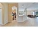 Open concept kitchen with a breakfast bar that overlooks the dining room at 1013 Emerald Dunes Dr, Sun City Center, FL 33573