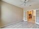 Bright office space with French doors and wood-look floors at 1013 Emerald Dunes Dr, Sun City Center, FL 33573