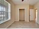 Spacious bedroom with walk-in closet and wood-look tile floors at 1013 Emerald Dunes Dr, Sun City Center, FL 33573