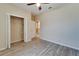 Bright bedroom with double door closet and wood-look tile floors at 1013 Emerald Dunes Dr, Sun City Center, FL 33573