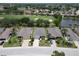 Aerial view of the house and surrounding golf course community at 1013 Emerald Dunes Dr, Sun City Center, FL 33573