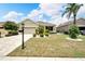 One-story house with a two-car garage and landscaped yard at 1013 Emerald Dunes Dr, Sun City Center, FL 33573