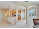 Open kitchen with light wood cabinets, stainless steel appliances, and a breakfast bar at 1013 Emerald Dunes Dr, Sun City Center, FL 33573
