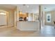 Bright kitchen boasts a large island and views into the adjacent dining area at 1013 Emerald Dunes Dr, Sun City Center, FL 33573