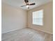 Bright bedroom with ceiling fan and wood-look tile flooring at 1013 Emerald Dunes Dr, Sun City Center, FL 33573