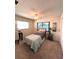 Well-lit bedroom with a twin bed and ceiling fan at 10032 36Th N St, Pinellas Park, FL 33782