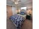 Cozy bedroom with a barn door and ceiling fan at 10032 36Th N St, Pinellas Park, FL 33782