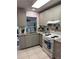 Updated kitchen featuring granite countertops and gray cabinets at 10032 36Th N St, Pinellas Park, FL 33782