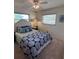Charming bedroom with a ceiling fan and decorative bedding at 10032 36Th N St, Pinellas Park, FL 33782