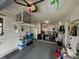 Organized garage with shelving and overhead storage at 10032 36Th N St, Pinellas Park, FL 33782