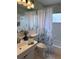 Clean bathroom with shower/tub combo and updated vanity at 10032 36Th N St, Pinellas Park, FL 33782