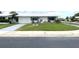 Ranch-style home with a well-manicured lawn at 10032 36Th N St, Pinellas Park, FL 33782