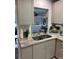 Modern kitchen with granite countertops and a double sink at 10032 36Th N St, Pinellas Park, FL 33782
