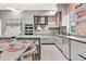 Modern kitchen with a large island, stainless steel appliances, and breakfast bar at 6018 Kipps Colony E Dr, Gulfport, FL 33707