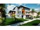 Modern two-story house with gray and wood accents at 6018 Kipps Colony E Dr, Gulfport, FL 33707