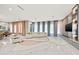 Open living space with large windows, modern furniture, and marble floors at 6018 Kipps Colony E Dr, Gulfport, FL 33707