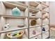 Well-lit pantry with built-in shelving for ample storage at 6018 Kipps Colony E Dr, Gulfport, FL 33707
