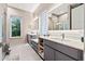 Modern bathroom boasts dual sinks, a large mirror, and a walk-in shower at 6018 Kipps Colony E Dr, Gulfport, FL 33707