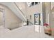 Modern two-story entryway with glass railings and marble floors at 6018 Kipps Colony E Dr, Gulfport, FL 33707