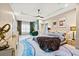 Large main bedroom with sitting area and a stunning accent wall at 6018 Kipps Colony E Dr, Gulfport, FL 33707