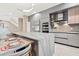 Modern kitchen with a large island, stainless steel appliances, and breakfast bar at 6018 Kipps Colony E Dr, Gulfport, FL 33707