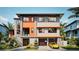 Modern two-story home with gray and orange accents at 6018 Kipps Colony E Dr, Gulfport, FL 33707