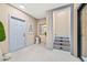 Subtle basement stairs and a light blue door at 6018 Kipps Colony E Dr, Gulfport, FL 33707