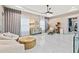 Bright sitting area features comfortable armchairs, an ottoman, and a marble floor at 6018 Kipps Colony E Dr, Gulfport, FL 33707
