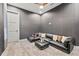 Relaxing sitting area with a black sectional sofa and plush pillows at 6018 Kipps Colony E Dr, Gulfport, FL 33707
