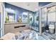 Stunning bathroom with blue walls, marble floors, and dual vanities at 6018 Kipps Colony E Dr, Gulfport, FL 33707