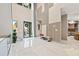 Modern two-story entryway with glass railings and marble floors at 6018 Kipps Colony E Dr, Gulfport, FL 33707
