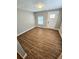 Bright living room featuring hardwood floors and neutral walls at 1703 Mobile Ave, Tampa, FL 33610