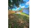 Spacious backyard, grassy area, and a concrete slab at 1703 Mobile Ave, Tampa, FL 33610
