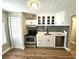 Modern kitchen with white cabinets, stainless steel appliances, and mosaic backsplash at 1703 Mobile Ave, Tampa, FL 33610