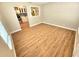Dining area with hardwood floors and view into the kitchen at 1703 Mobile Ave, Tampa, FL 33610
