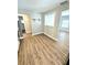 Dining area with hardwood floors and view into kitchen and bathroom at 1703 Mobile Ave, Tampa, FL 33610