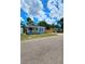 Blue house with a fenced yard and covered front porch at 1703 Mobile Ave, Tampa, FL 33610