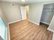 Spacious bedroom with wood-look flooring and a large closet at 1703 Mobile Ave, Tampa, FL 33610