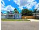 Cute bungalow with a fenced yard and a covered porch at 1703 Mobile Ave, Tampa, FL 33610