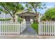 White picket fence surrounds this charming craftsman home at 2716 N Jefferson St, Tampa, FL 33602