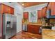 Kitchen with stainless steel appliances, granite countertops, and wood cabinets at 2716 N Jefferson St, Tampa, FL 33602